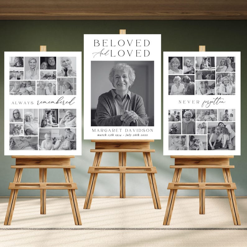 May include: Three wooden easels display memorial posters. The central poster reads "BELOVED and LOVED" above a grayscale portrait. The other posters feature photo collages with the phrases "ALWAYS remembered" and "NEVER forgotten."