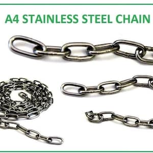 May include: A4 stainless steel chain, a type of metal chain used for various purposes. The chain is made of individual links that are connected together. The chain is shown in three different configurations: a single strand, a coiled strand, and a straight strand.