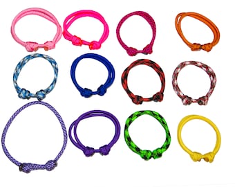 May include: Assortment of 12 colorful paracord bracelets with various patterns and knots. The bracelets are made of durable nylon cord and feature a variety of colors, including blue, green, red, orange, pink, purple, and yellow.