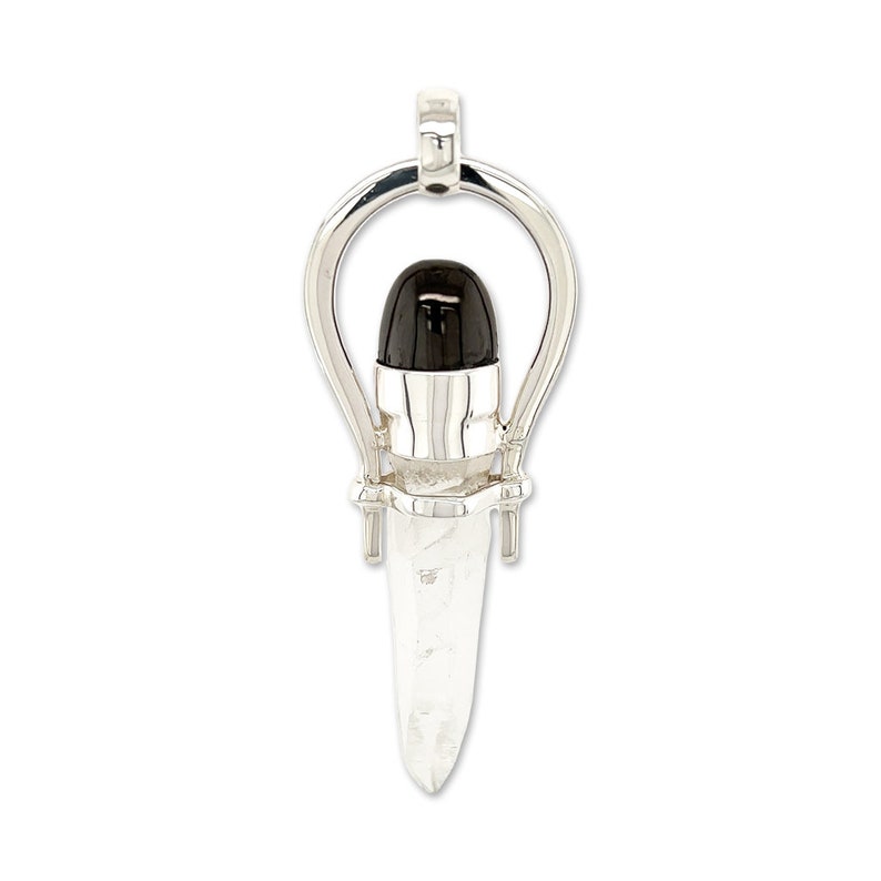 May include: A silver pendant featuring a clear quartz crystal point with a black gemstone at the top, set in a silver frame.