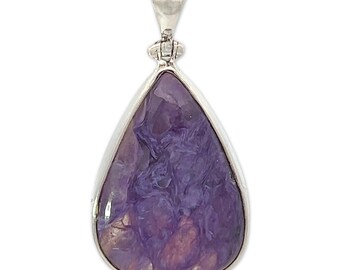 May include: A teardrop-shaped pendant with a purple and white chalcedony stone set in sterling silver.