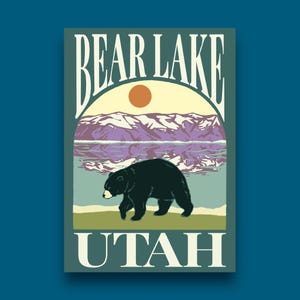 May include: A vintage-style travel poster featuring a black bear walking in front of a lake with mountains in the background. The poster says "Bear Lake, Utah" in a retro font.