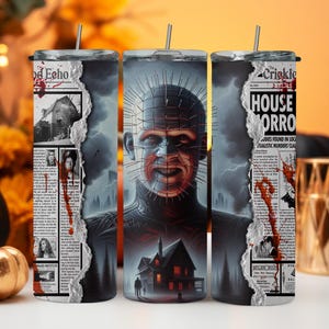 May include: Three stainless steel tumblers with a horror movie theme. The tumblers feature a newspaper clipping with the headline "House of Horror" and a graphic of a character with a spiked head. The tumblers are a great way to show your love for horror movies.