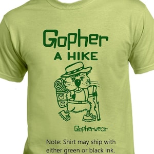 May include: A green t-shirt with a cartoon gopher wearing a hat and carrying a backpack. The text "Gopher A HIKE" and "Gopherwear" are printed on the shirt. Note: Shirt may ship with either green or black ink.