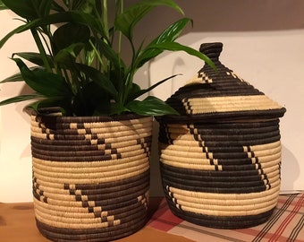 Grass-woven lidded storage baskets handmade in communities bordering Bwindi impenetrable National park, Uganda- distinctive Monochrome style