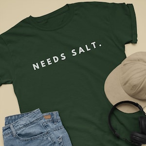 Needs Salt food design shirt, Culinary apparel, Foodie t-shirt, Food lover's, Food-themed clothing, Cook fashion, Food-inspired, Funny Gift