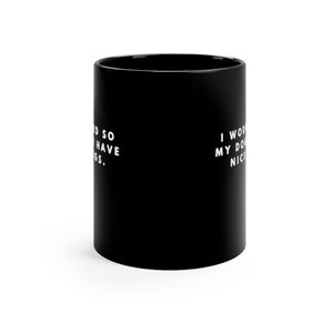 May include: Black ceramic coffee mug with white text that reads "I work so hard so I can have dogs." on the left side and "I work hard so my dogs can have nice things." on the right side.