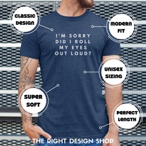 May include: A navy blue t-shirt with the text "I'm sorry did I roll my eyes out loud?" printed in white. The shirt is described as having a classic design, modern fit, unisex sizing, super soft fabric, and a perfect length.