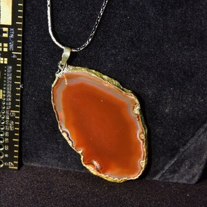 Agate Slice Necklace With Decorative Gold Trim.  Comes With Chain.