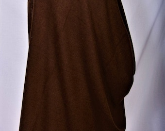 May include: A dark brown shawl draped over a form. The fabric appears to be a soft, woven material. The shawl is a solid colour and has a simple, elegant design. The edges of the shawl are slightly curved.