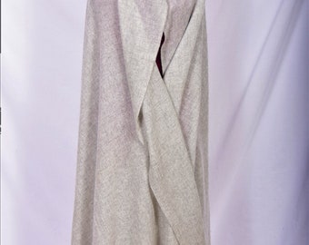 May include: A light grey wool shawl draped over a mannequin. The shawl is folded in half and the edges are visible.