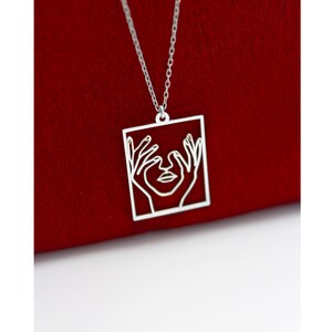 Hands On Her Face Woman Necklace