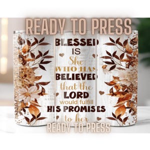 May include: A white tumbler with a brown and gold floral design and the text "Blessed is she who has believed that the Lord would fulfill his promises to her".