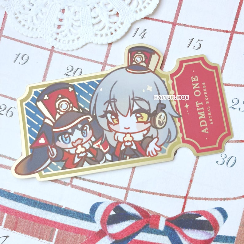 May include: A gold-colored ticket with the text "ADMIT ONE" and "ASTRAL EXPRESS" printed on it. The ticket features two cartoon characters, one with a red and white hat and the other with a blue and white hat. The characters are smiling and holding a small object.