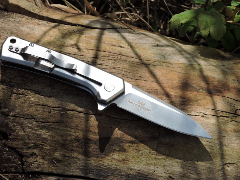 May include: A set of three ceramic mugs with a speckled, matte finish. The mugs are in shades of cream, light gray, and dark gray. Each mug has a simple, minimalist design and a rounded handle.