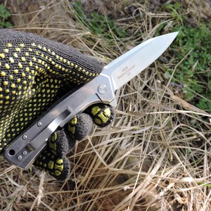 May include: A set of three ceramic mugs with a speckled, matte finish. The mugs are in shades of cream, light gray, and dark gray. Each mug has a simple, minimalist design and a rounded handle.