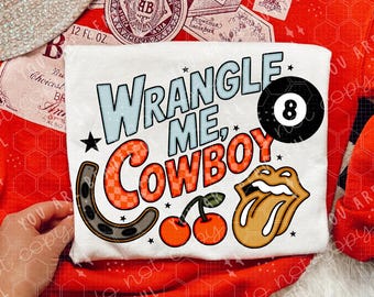 May include: A red sweatshirt with a beer label design and the text "YOU ARE BEAUTIFUL". A white t-shirt with the text "WRANGLE ME, COWBOY" and graphic designs. A straw hat and white sneakers with cherry designs are also visible.