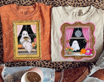 May include: Two t-shirts with Halloween designs. One is orange with a ghost holding a mug in a framed window. The other is beige with a ghost in a window with pink curtains, a disco ball, and a pumpkin.