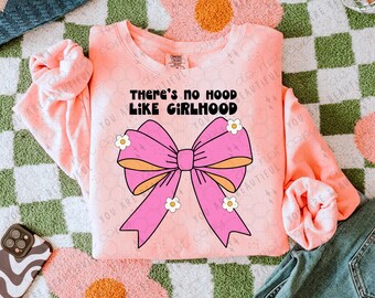 May include: Pink sweatshirt with a pink bow and the text "There's no hood like girlhood".
