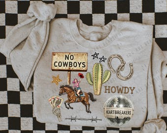 May include: A light gray sweatshirt with a western theme. It features a sign that reads "NO COWBOYS", a woman riding a horse, a cactus, horseshoes, stars, and the word "HOWDY". A disco ball says "HEARTBREAKERS".