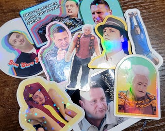 May include: A collection of holographic stickers featuring various images of a man in different poses and outfits. Some stickers include text such as "You Sure?" and "Shut the fuck up Doug, you fucking skunk!"
