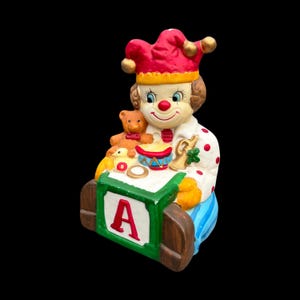 Vintage Clown Bisque Music Box w Alphabet Block, Teddy Bear, Trumpet, Drum & Duck (Plays Santa Claus is Coming to Town Christmas Song) AS IS