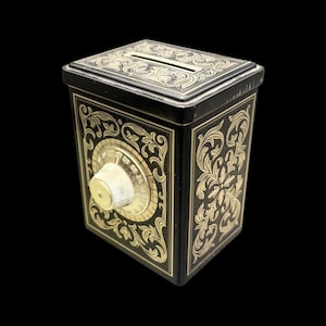 Vintage Avon Safe Tin Coin Bank Black & Gold Tone (Made in England) 4”
