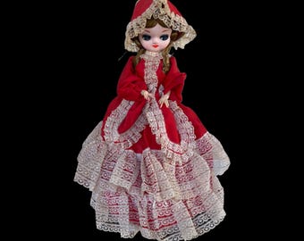 Vintage jaren 1970 Bradley Big Eyed Korean Poseable Boudoir Southern Belle-pop met kastanjebruine vlechten, blauwe ogen, rode kanten jurk en motorkap 15-inch (zoals deze is)