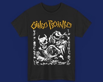 May include: Black t-shirt with a white graphic print of a skeleton with a skull and horns. The text "Jingo Boingo" is printed in yellow above the graphic.