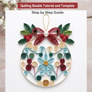 May include: A paper quilling bauble tutorial and template with a step by step guide. The bauble features a red bow, a white pearl, green leaves, red berries, and intricate light blue, dark green, and beige paper scrolls in a floral pattern.