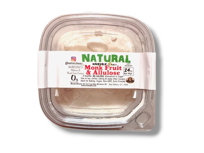 May include: A clear plastic container with a white powder inside. The label reads "NATURAL Monk Fruit & Allulose" with the text "A Healthy, NO CALORIE Alternative to Sugar. Use in tea, coffee, baking & many other recipes. Ideal for Baking, Vegan, Non-GMO, Keto Friendly." The label also includes the text "24 oz Net Wt."