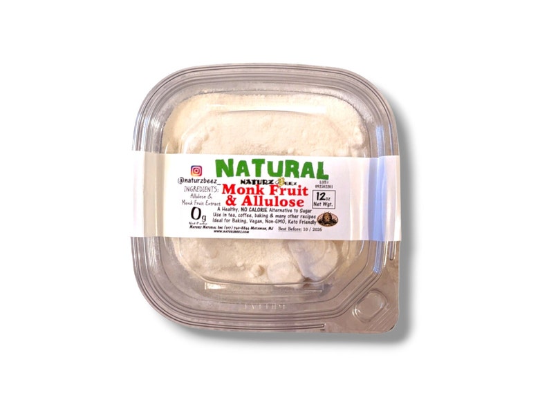 May include: A clear plastic container with a white powder inside. The label reads "NATURAL Monk Fruit & Allulose" with the ingredients listed as "Allulose & Monk Fruit Extract". The label also states "A Healthy, NO CALORIE Alternative to Sugar. Use in tea, coffee, baking & many other recipes. Ideal for baking, Vegan, Non-GMO, Keto Friendly."