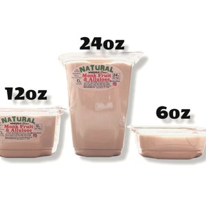May include: Three clear plastic containers of different sizes filled with a light brown liquid. The containers are labeled "Natural Monk Fruit & Allulose" with the size in ounces: 6oz, 12oz, and 24oz.