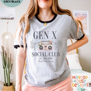 next level ribbed shirt for gen x woman that says gen x social club est. 1965-1980 we dont care with a cute pink boom box