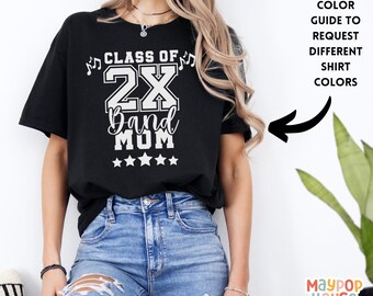 May include: Black t-shirt with white text that reads "Class of 2X Band Mom" with musical notes and five stars.