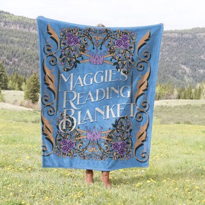 personalized velveteen plush blanket for someone who loves books and reading designed to look like a blue vintage book cover