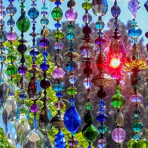 Luxury beaded curtain. 60 strands. Graduated lengths from 28-40 inch long.About 175 total linear feet.  Crystal, glass, natural gemstone