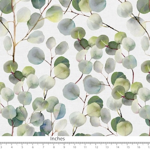 May include: A repeating pattern of watercolor eucalyptus leaves and branches in shades of green and blue on a white background. The image shows the leaves and branches. The text "Inches" is at the bottom of the image.