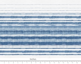 May include: A fabric with a watercolour-style design featuring horizontal stripes in varying shades of blue and white. The pattern includes both solid and dotted lines, creating a textured appearance. The image includes a ruler with inches.