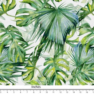 Peut inclure: Motif aquarelle de feuilles tropicales vertes et bleues, dont des monstera et des palmes, sur fond blanc. Le motif est vibrant et naturel. L'image comprend une règle avec des pouces.