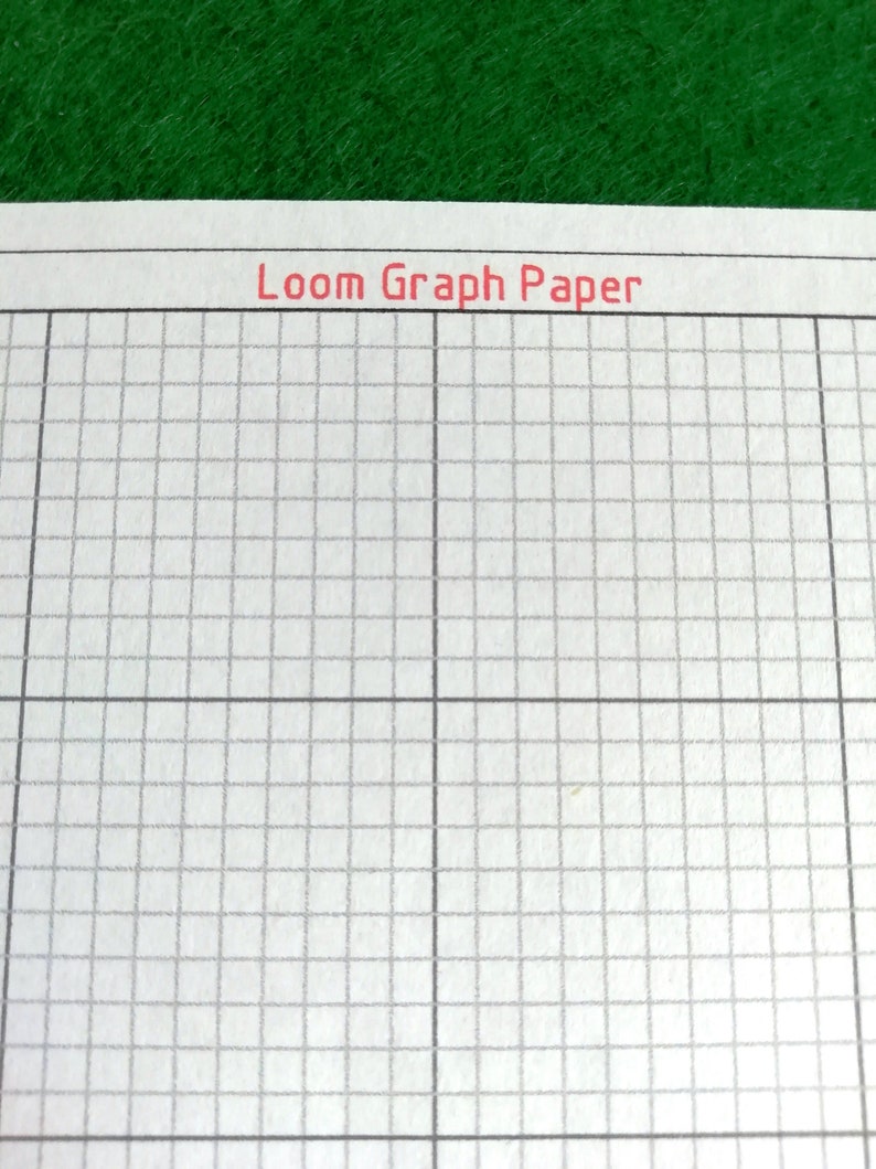 May include: White paper featuring a grid pattern for loom weaving, with the text Loom Graph Paper printed in red at the top. The grid consists of thin gray lines forming small squares, organized into larger sections by thicker black lines.