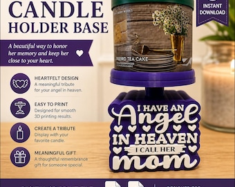 May include: A purple 3D printed candle holder base featuring the white embossed text I HAVE AN ANGEL IN HEAVEN I CALL HER MOM with heart accents. The base supports a cylindrical candle with a green lid and a label depicting a tea cake and flowers.
