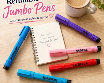 May include: Refillable 3D jumbo pens in blue, purple, pink, and red, each personalized with a name. The pens feature a hexagonal barrel, a clip, and a black tip. A small spiral notebook with the text Fun colors. Custom name. Made just for you! is included.