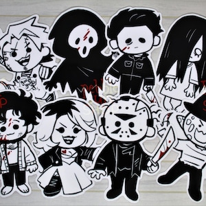May include: A collection of black and white cartoon stickers featuring horror movie characters, including Chucky, Ghostface, Michael Myers, Sadako, Leatherface, and Freddy Krueger. Each character is depicted with a weapon and blood splatter.