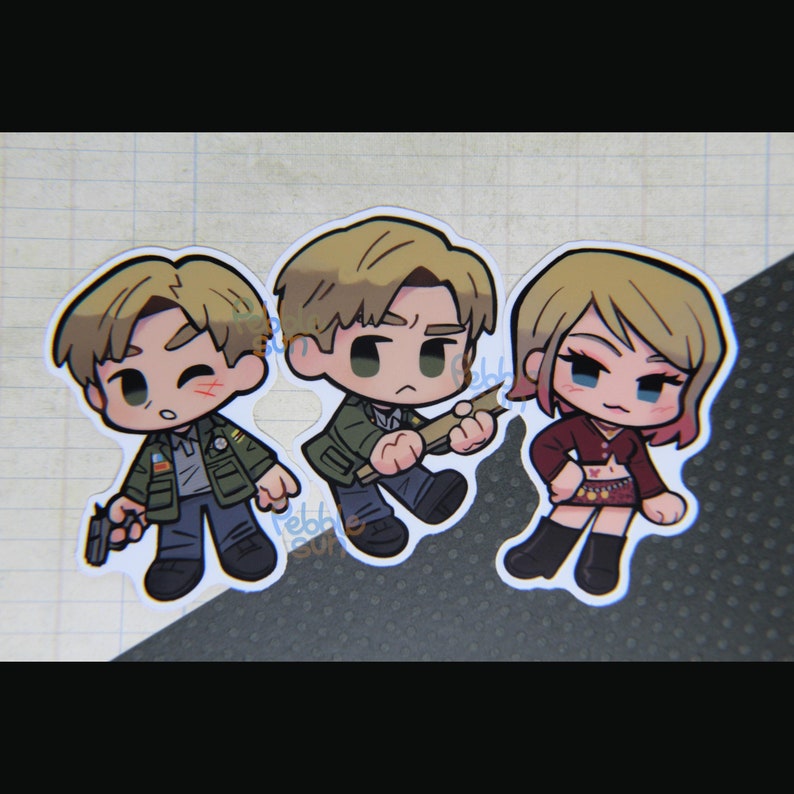 May include: Three chibi-style stickers featuring characters from a video game. The stickers depict two men and one woman, each with unique outfits and expressions. One man holds a gun, another a wooden plank, and the woman wears a red top and skirt.