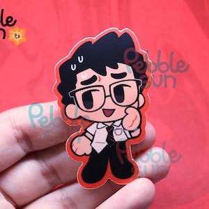 May include: A cartoon sticker featuring a character with black hair, glasses, and a white shirt with a tie. The sticker has a red border and the text "Pebble Sun" in the upper left corner. The character is giving a thumbs up.