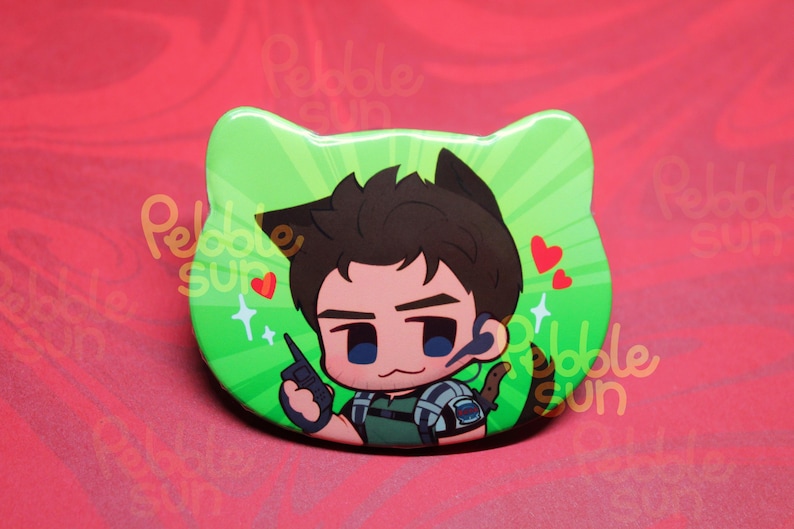 May include: A green cat-shaped button featuring a cartoon character with brown hair and cat ears. The character is holding a device and has a headset. Red hearts and sparkles decorate the background.