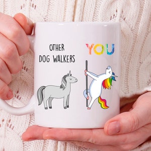 May include: White ceramic mug with a black and white unicorn illustration on the left side and a rainbow unicorn illustration on the right side. The text "Other Dog Walkers" is above the left unicorn and the text "You" is above the right unicorn.