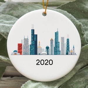May include: White ceramic bauble featuring a colourful silhouette of the Chicago skyline with the year 2020 printed below.