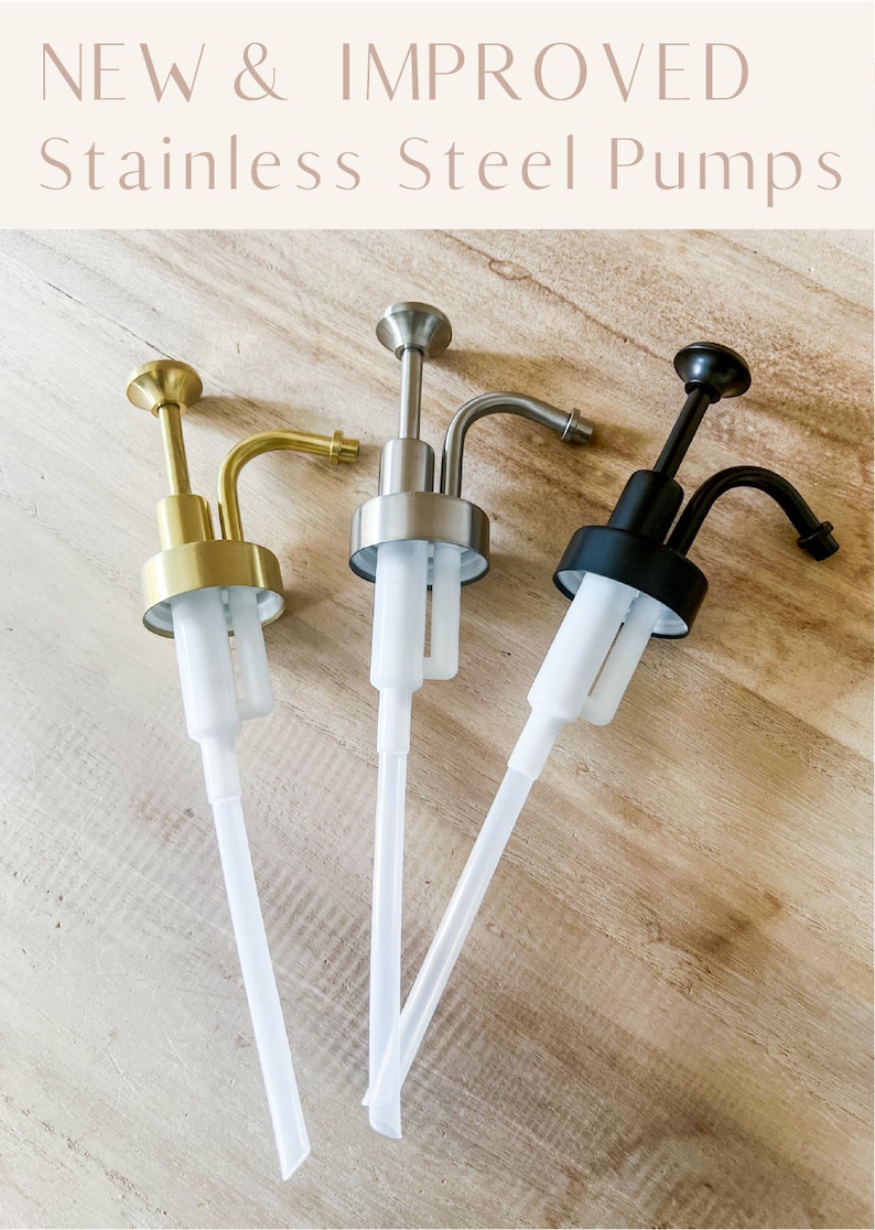 May include: Three soap pumps with different finishes: gold, silver, and black. The pumps have clear plastic tubes.